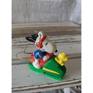 United feature Snoopy snowmobile woodstock green o